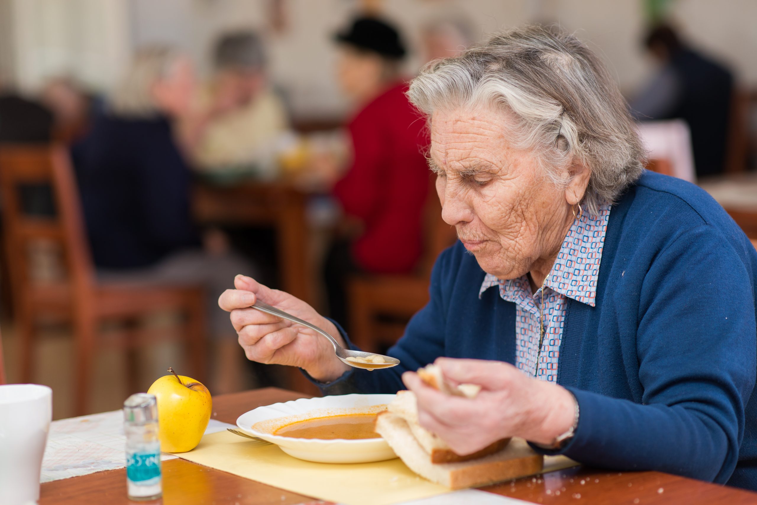 elderly woman eating