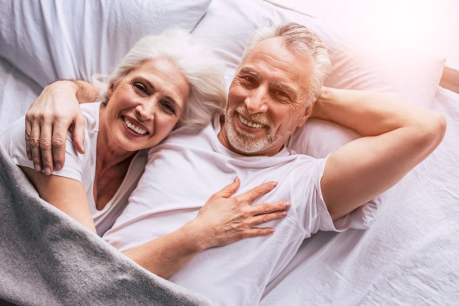 elderly couple in bed
